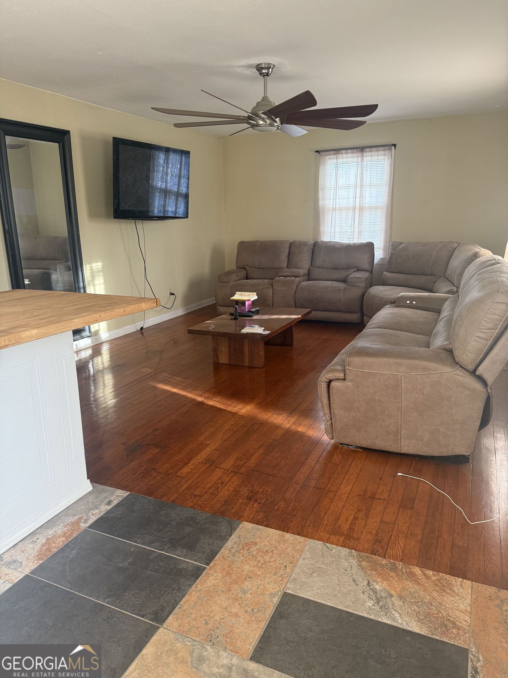 3861 Newnan Road Griffin, GA 30223 - Photo 13 of 89 a living room with furniture and a flat screen tv