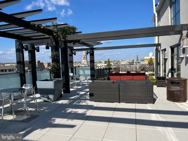 a view of a dining room with furniture and a chandelier