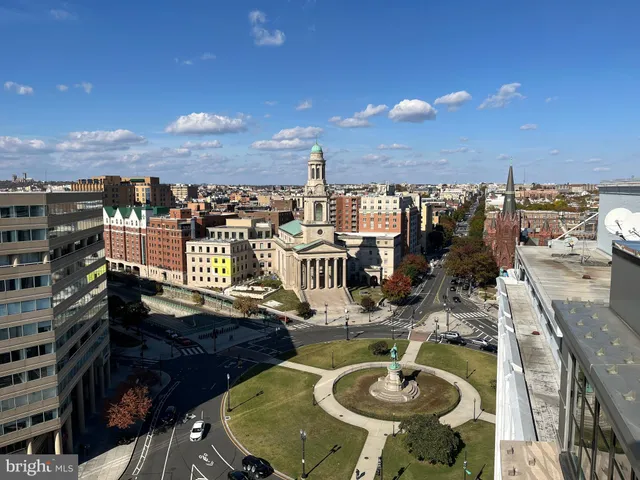a lobby with furniture and floor to ceiling window