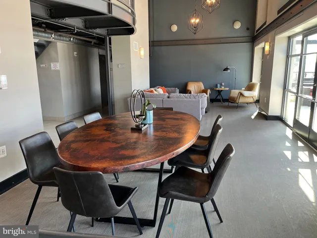 a dining room with furniture and window