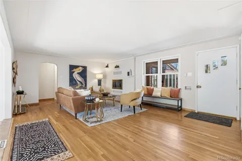 a living room with furniture and a rug