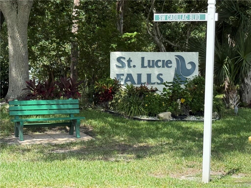2574 Southwest Monarch Trail Stuart, FL 34997 - Photo 1 of 21 a sign on the side of a yard