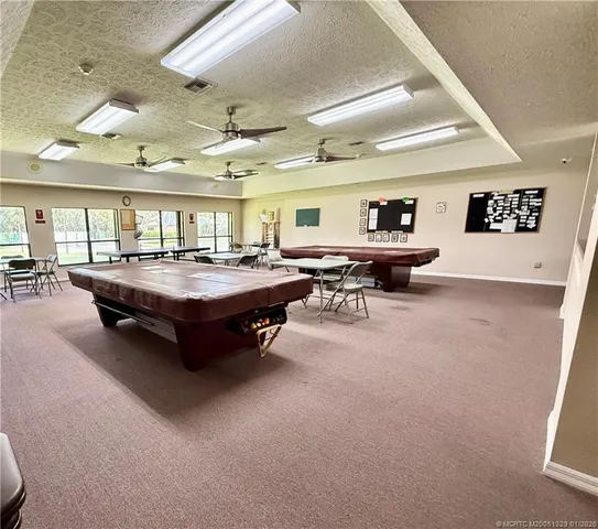 a living room with lots of furniture and a chandelier