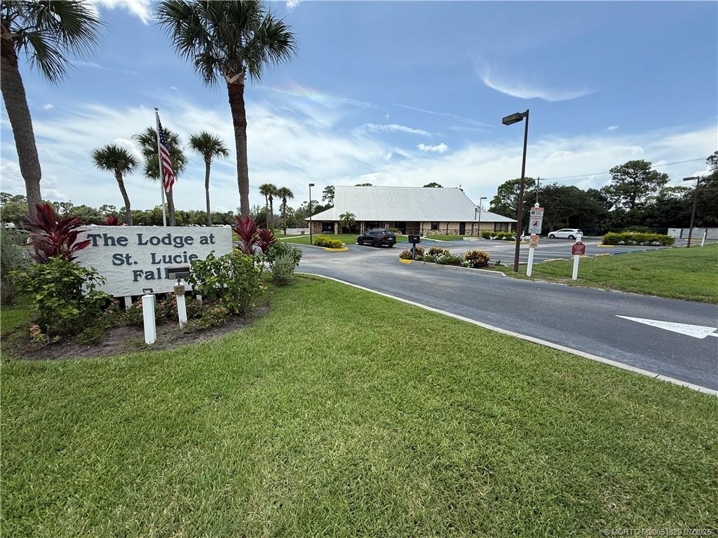 2574 Southwest Monarch Trail Stuart, FL 34997 - Photo 15 of 21 a front view of a house with garden
