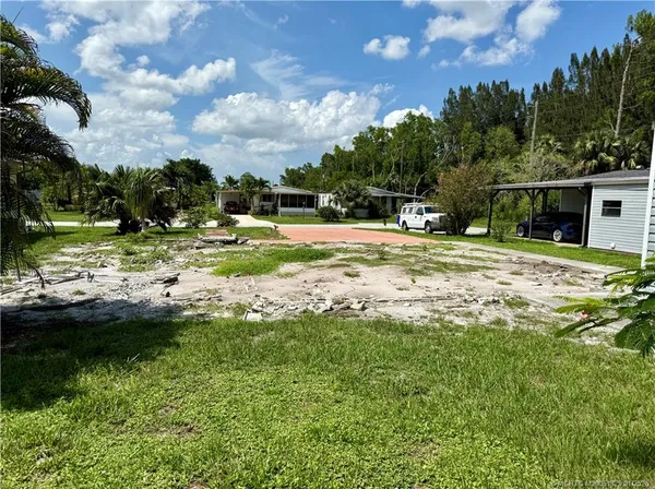 a view of a backyard of the house