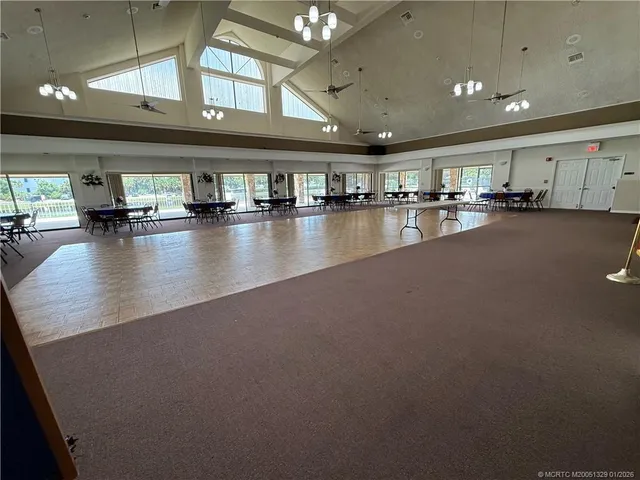 a view of a living room and hall with kitchen view
