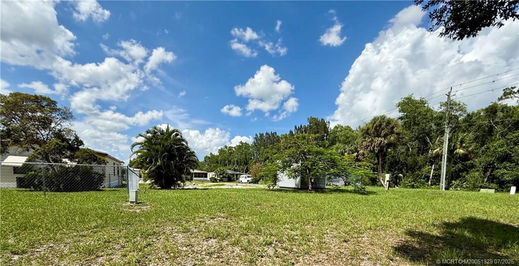 2574 Southwest Monarch Trail Stuart, FL 34997 - Photo 9 of 21 a view of a house with a big yard