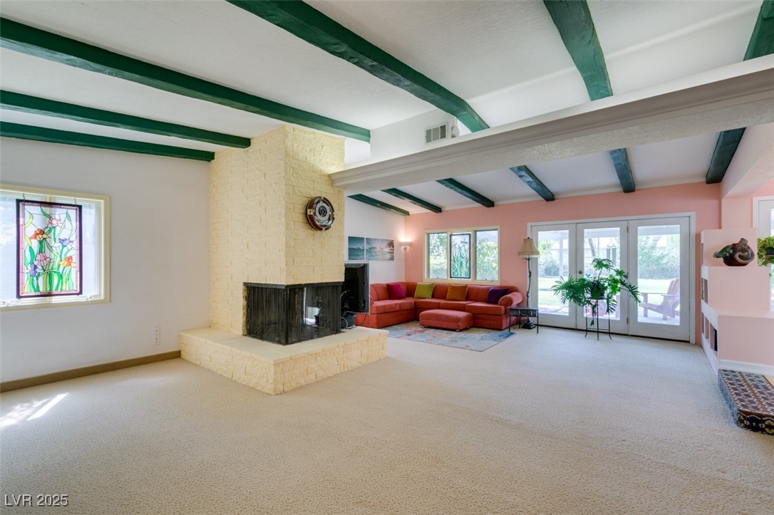 4087 Pleasant Road Las Vegas, NV 89108 - Photo 40 of 74 Carpeted living room featuring a fireplace and baseboards