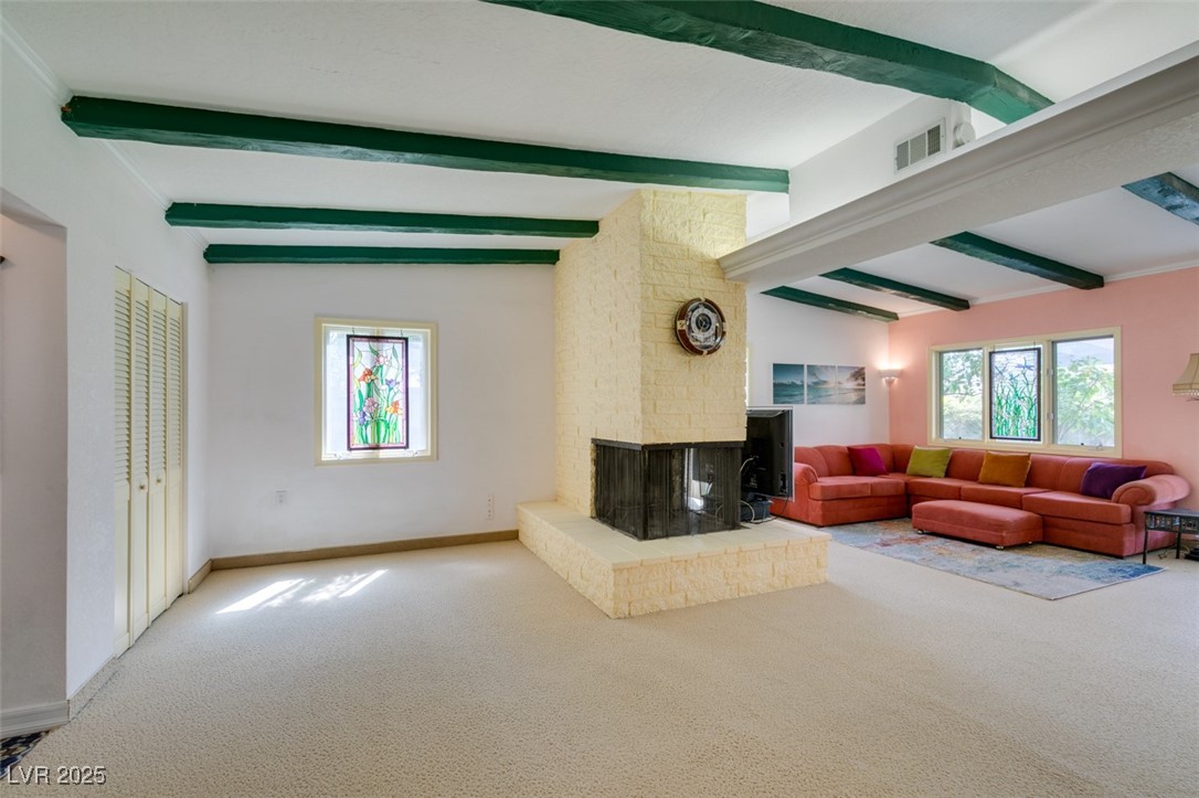 4087 Pleasant Road Las Vegas, NV 89108 - Photo 41 of 74 Carpeted living area with a fireplace and baseboards