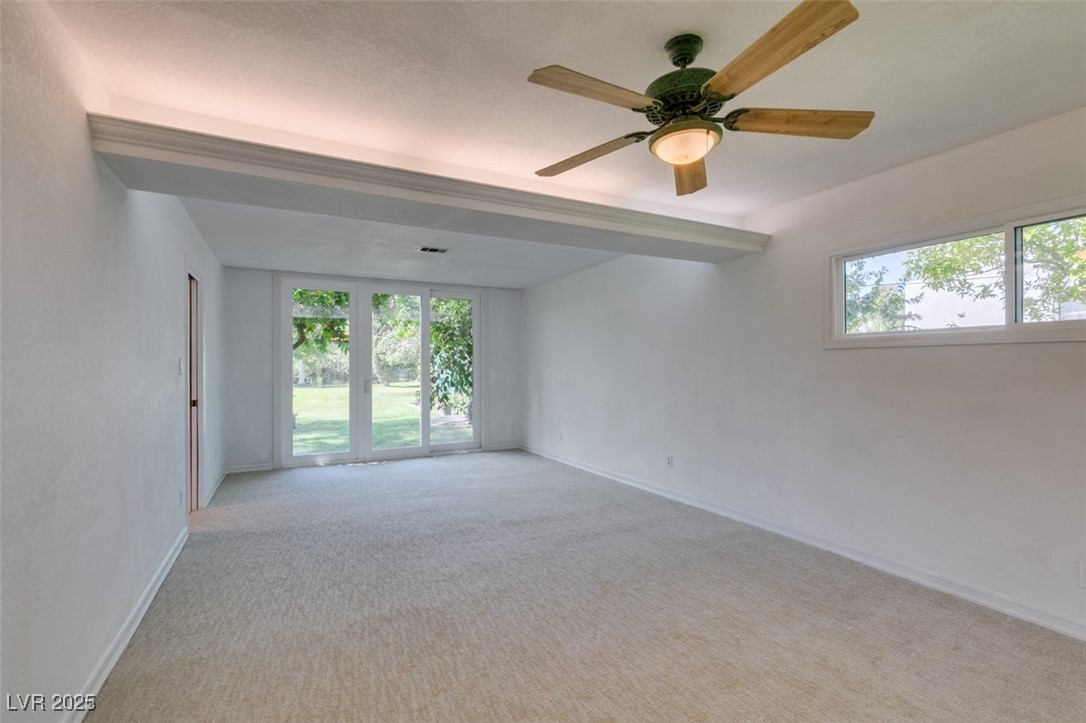 4087 Pleasant Road Las Vegas, NV 89108 - Photo 42 of 74 Empty room featuring healthy amount of natural light, carpet, and a ceiling fan