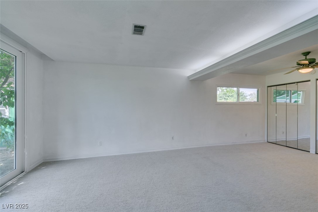 4087 Pleasant Road Las Vegas, NV 89108 - Photo 45 of 74 Carpeted spare room featuring a ceiling fan and baseboards