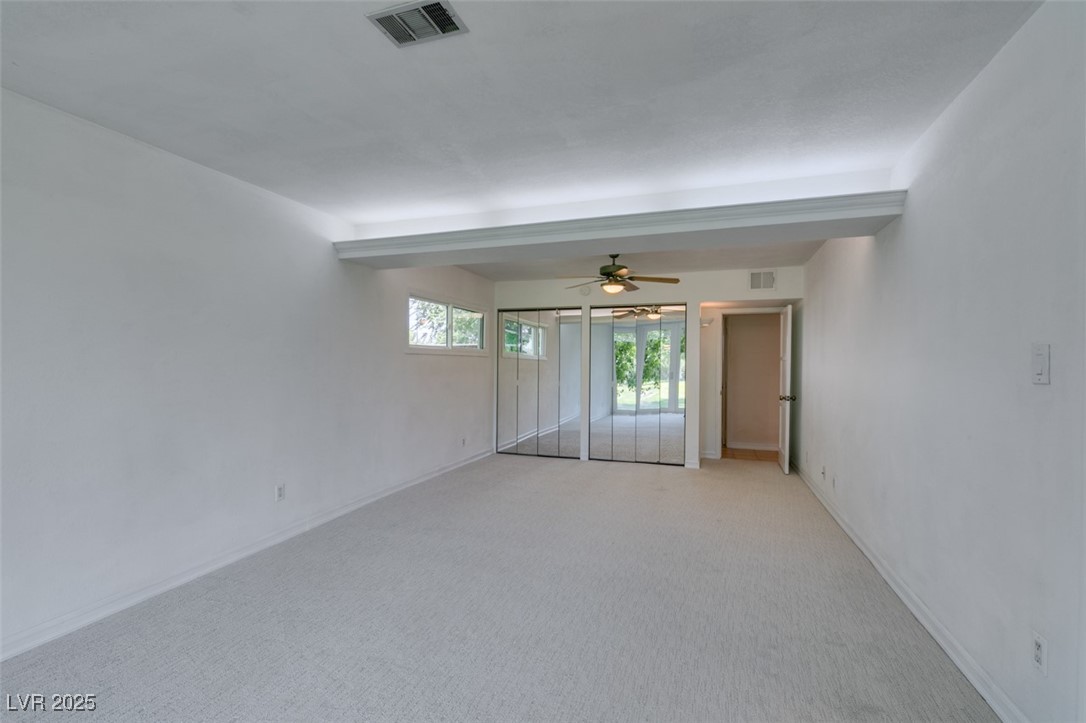 4087 Pleasant Road Las Vegas, NV 89108 - Photo 46 of 74 Empty room featuring light carpet and ceiling fan