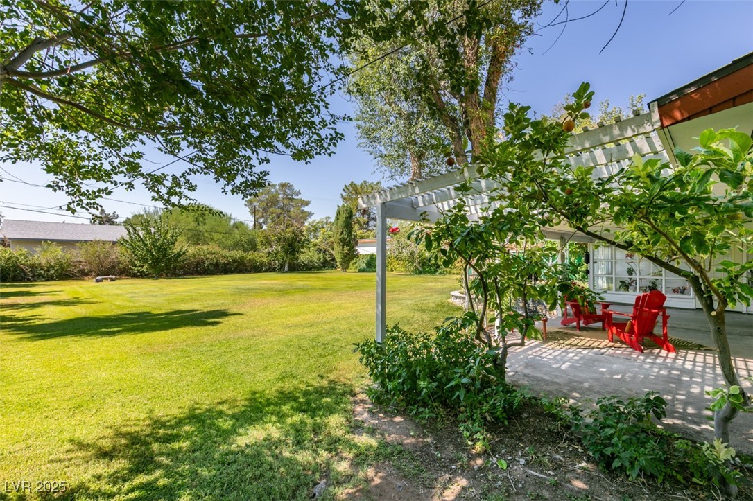 4087 Pleasant Road Las Vegas, NV 89108 - Photo 54 of 74 View of grassy yard featuring a patio area