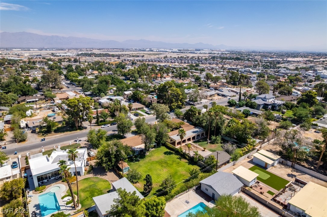4087 Pleasant Road Las Vegas, NV 89108 - Photo 64 of 74 Aerial view of residential area featuring a mountainous background and a pool