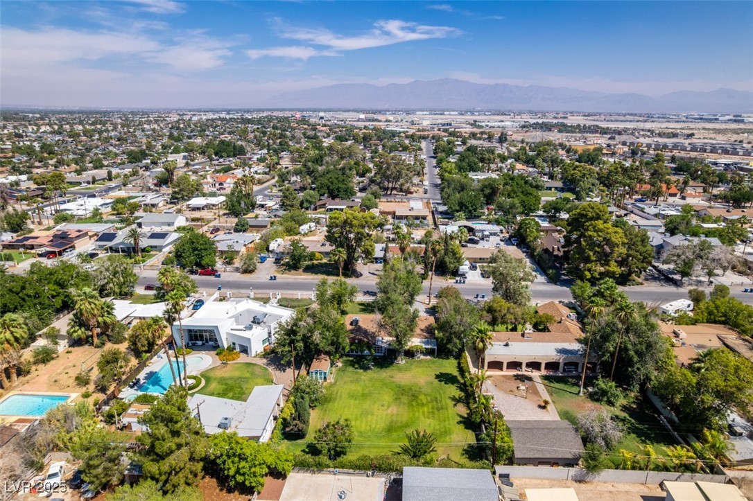 4087 Pleasant Road Las Vegas, NV 89108 - Photo 65 of 74 Aerial perspective of suburban area with a mountain backdrop