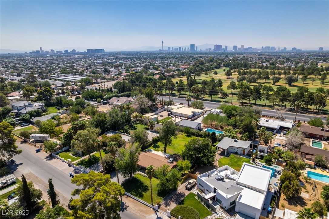 4087 Pleasant Road Las Vegas, NV 89108 - Photo 67 of 74 Aerial view of residential area with city skyline