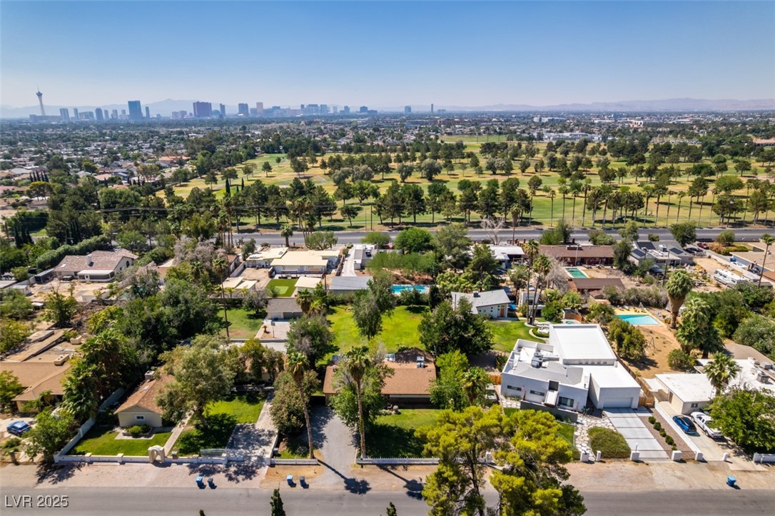 4087 Pleasant Road Las Vegas, NV 89108 - Photo 68 of 74 Aerial perspective of suburban area with city skyline