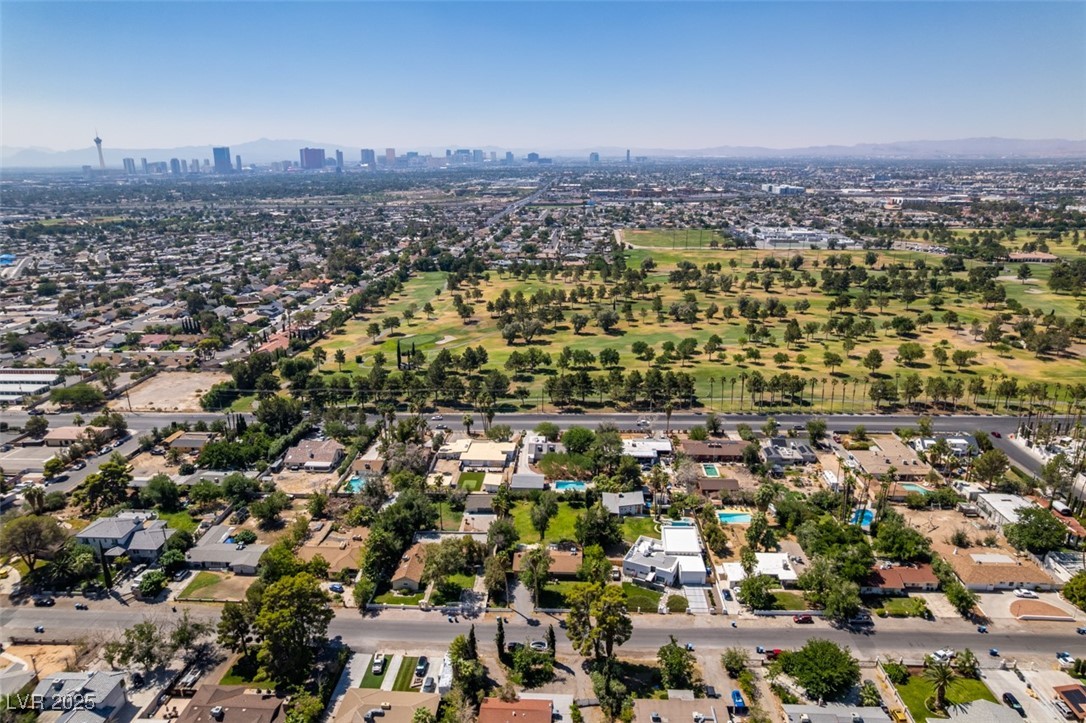 4087 Pleasant Road Las Vegas, NV 89108 - Photo 70 of 74 Aerial view of property's location featuring nearby suburban area, city skyline, and mountains