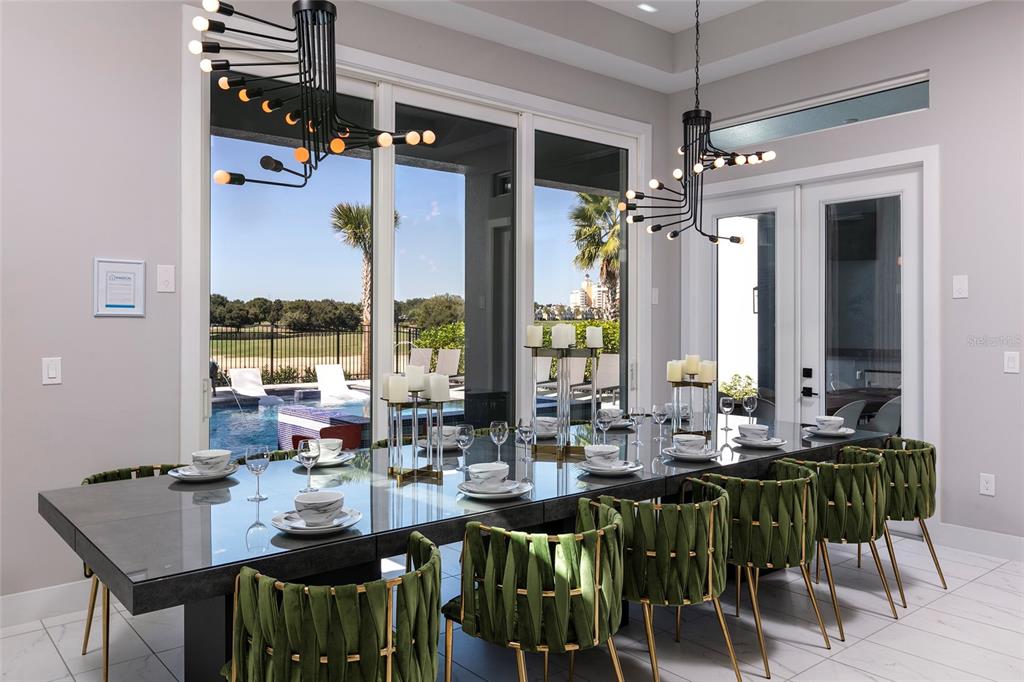 1514 Corolla Court Reunion, FL 34747 - Photo 12 of 74 a view of a dining room with furniture window and outside view