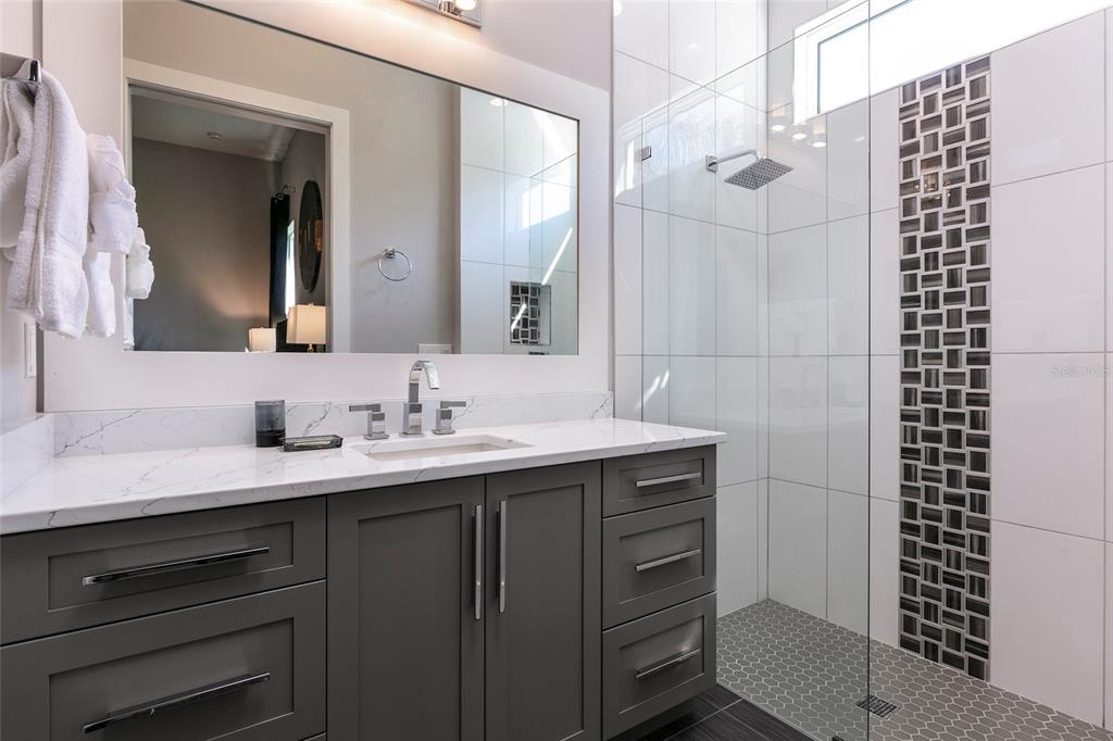 1514 Corolla Court Reunion, FL 34747 - Photo 19 of 74 a bathroom with a sink and a mirror