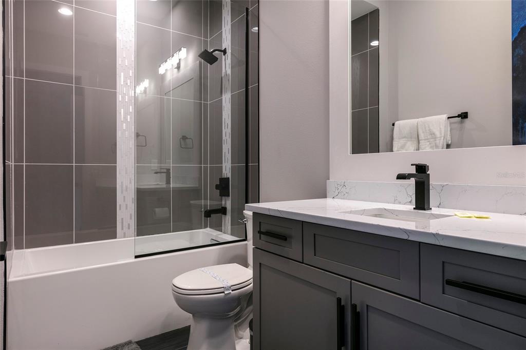 1514 Corolla Court Reunion, FL 34747 - Photo 35 of 74 a bathroom with a sink a toilet and shower