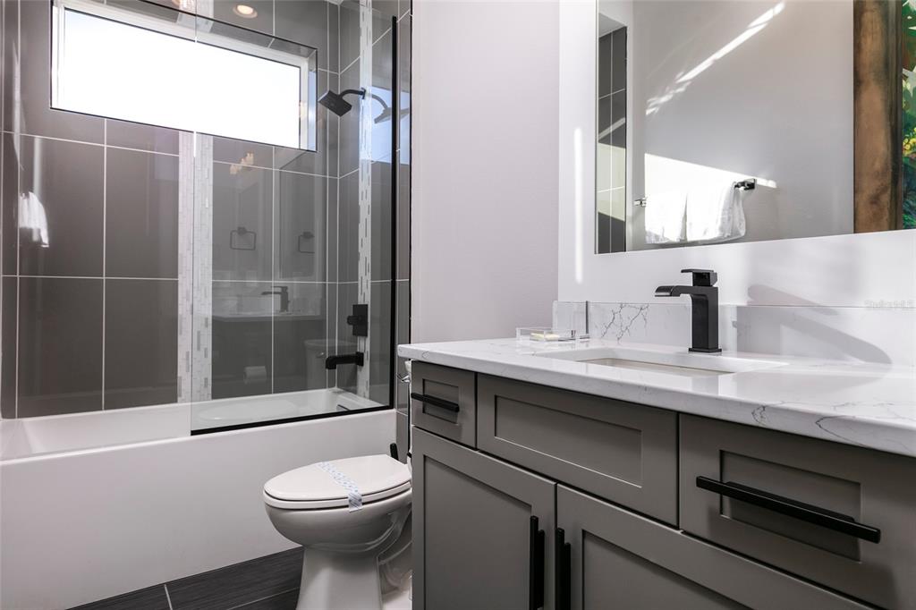 1514 Corolla Court Reunion, FL 34747 - Photo 38 of 74 a bathroom with a sink a toilet and shower