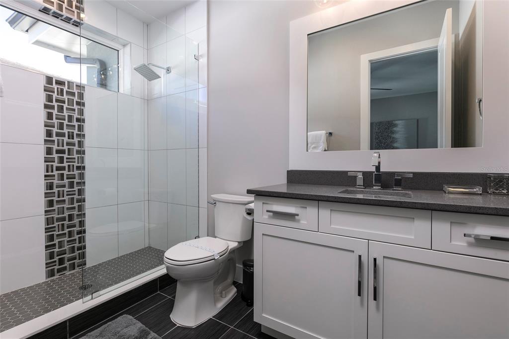 1514 Corolla Court Reunion, FL 34747 - Photo 40 of 74 a bathroom with a sink toilet and shower
