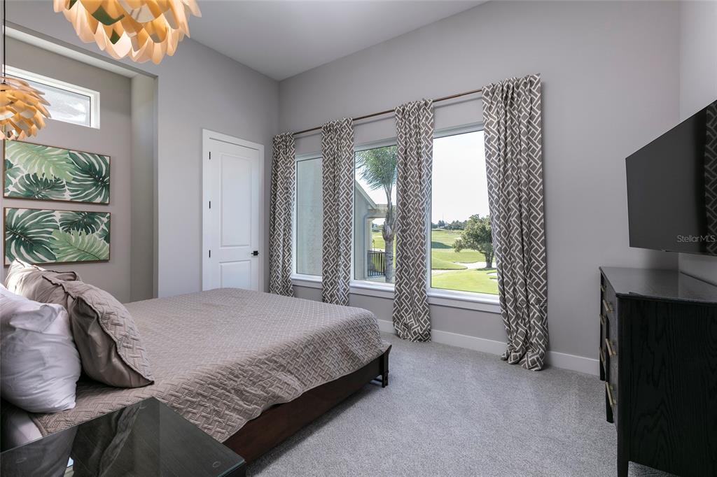 1514 Corolla Court Reunion, FL 34747 - Photo 41 of 74 a bedroom with a bed and a television