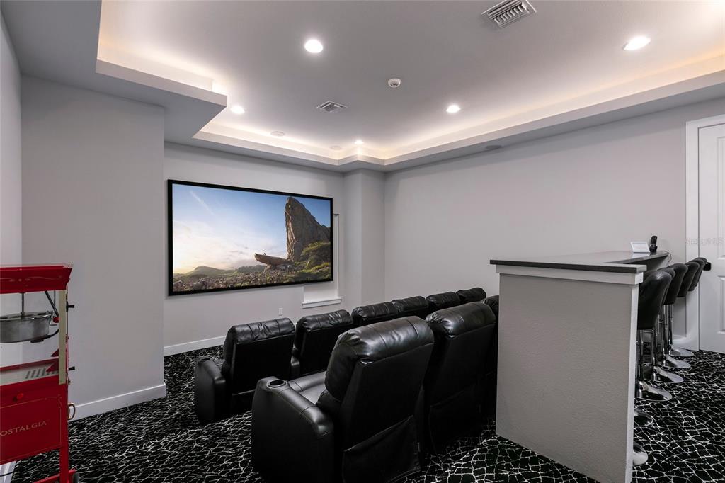 1514 Corolla Court Reunion, FL 34747 - Photo 49 of 74 a room with furniture projector and screen