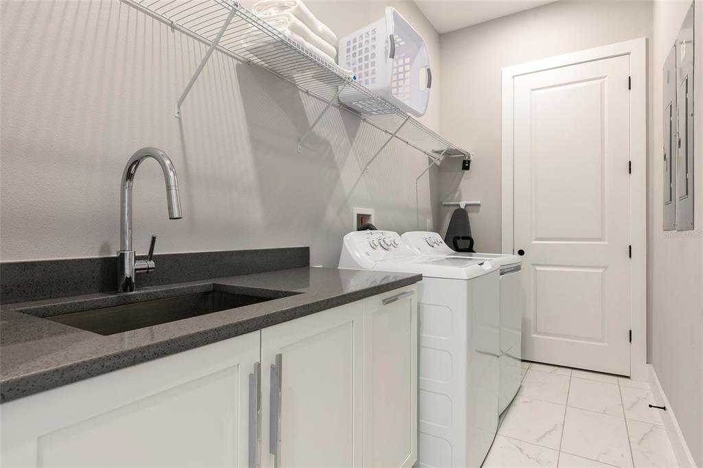 1514 Corolla Court Reunion, FL 34747 - Photo 65 of 74 a kitchen with a sink and cabinets