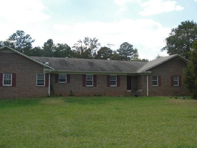 89 Booger Bear Road Buckhead, GA 30625 - Photo 1 of 1 a backyard of a house with large trees