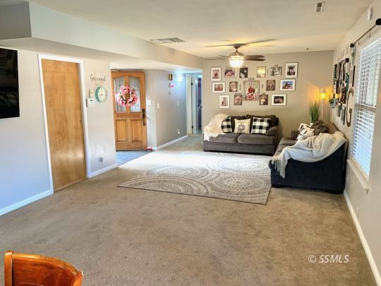 217 Rancho Street Ridgecrest, CA 93555 - Photo 6 of 25 a bedroom with furniture and window