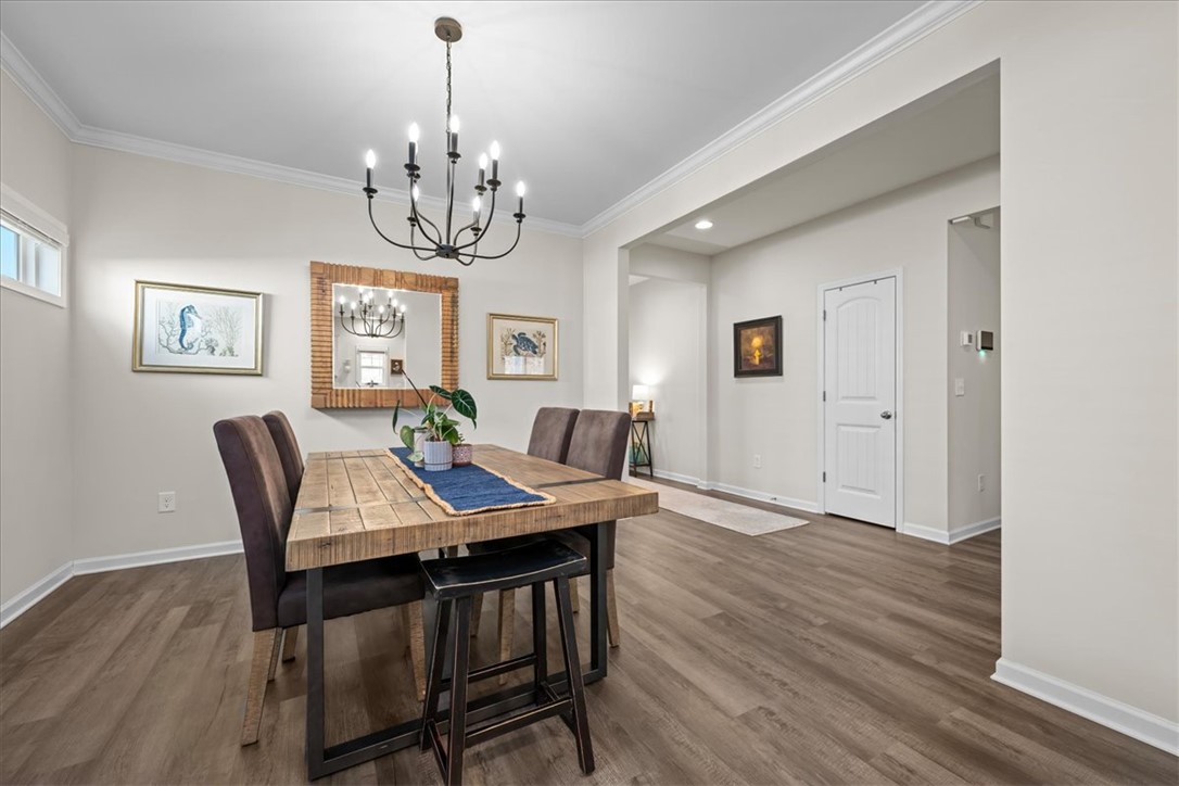 216 Carvel Trail Seneca, SC 29678 - Photo 12 of 48 This bright dining area features an elegant chandelier and warm wood flooring.