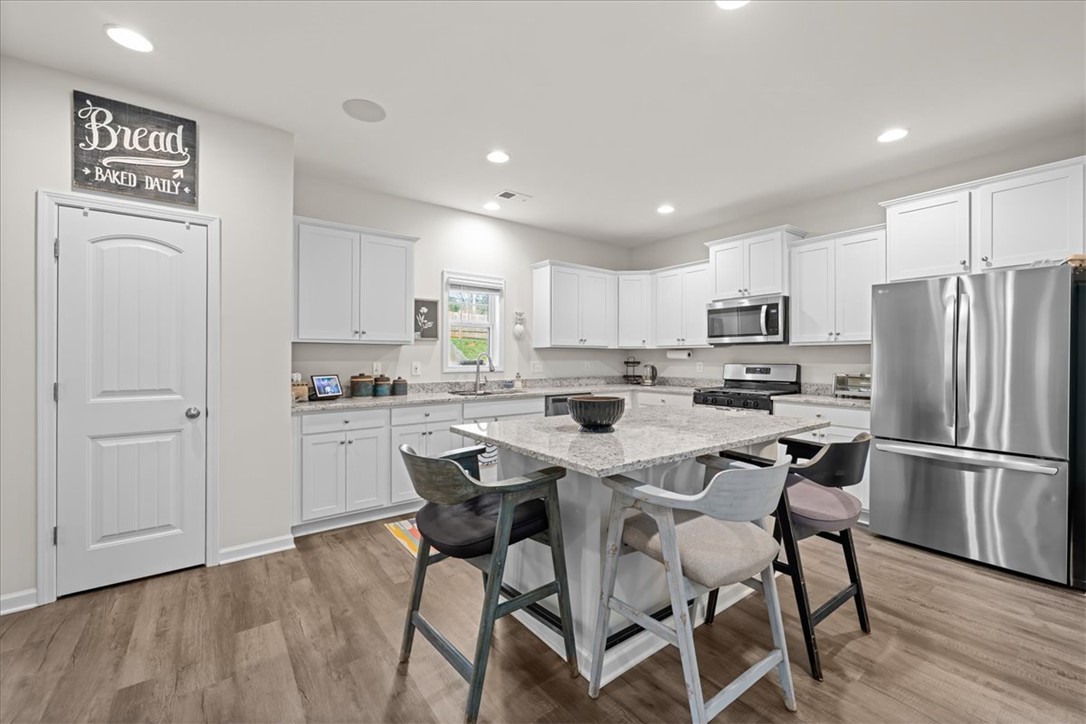 216 Carvel Trail Seneca, SC 29678 - Photo 14 of 48 This modern kitchen features a functional layout, perfect for everyday living and entertaining.