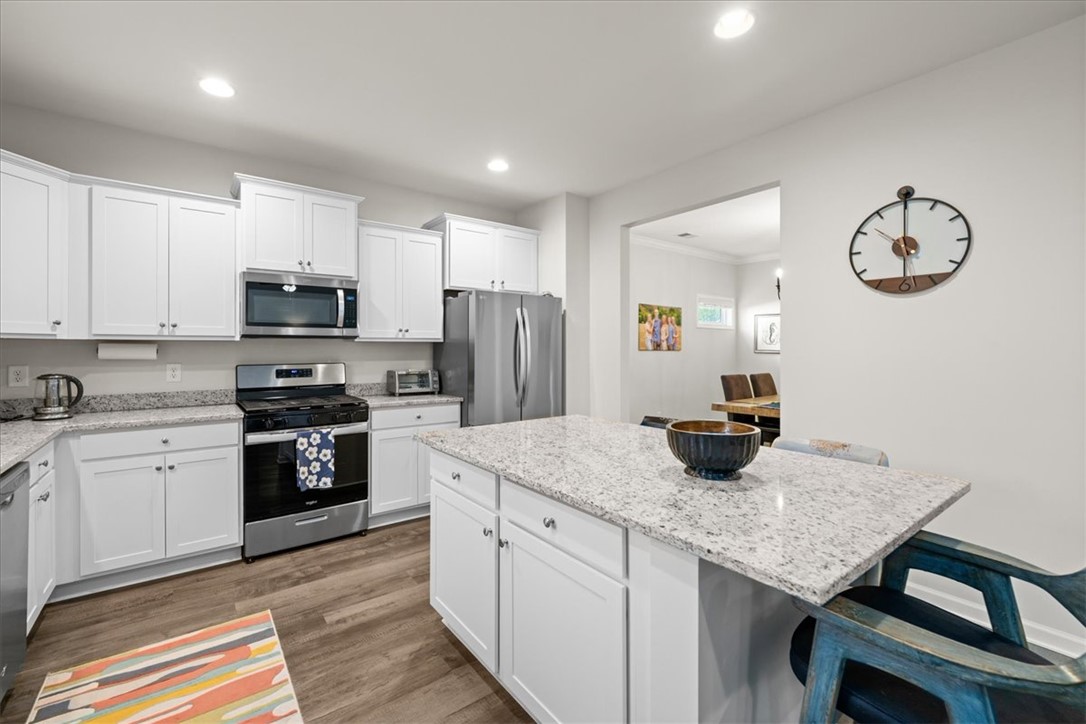216 Carvel Trail Seneca, SC 29678 - Photo 17 of 48 This kitchen features a bright, open design, with modern appliances and a functional island.