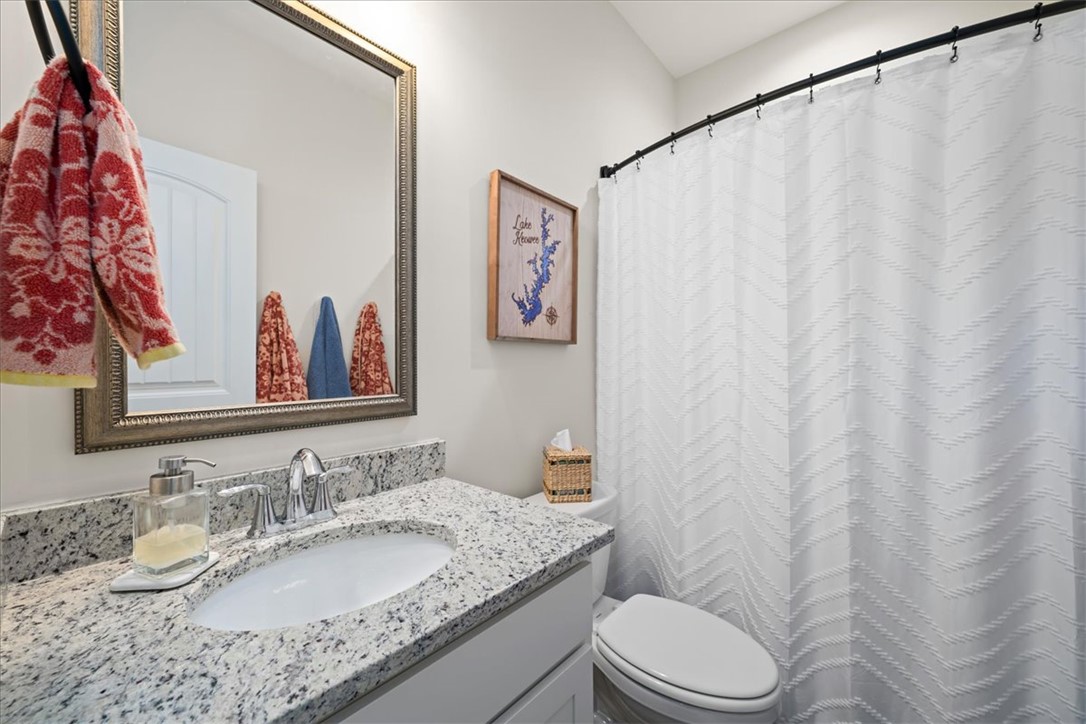 216 Carvel Trail Seneca, SC 29678 - Photo 21 of 48 This bathroom features a contemporary vanity with a granite countertop and a sleek sink.