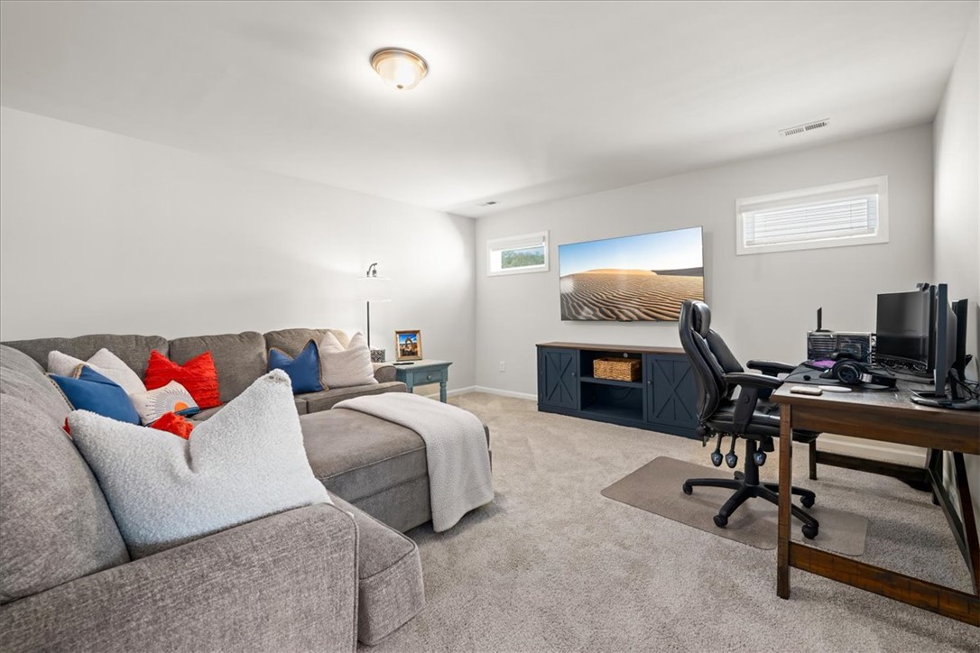 216 Carvel Trail Seneca, SC 29678 - Photo 22 of 48 This versatile living area offers comfort and functionality with carpeted flooring.