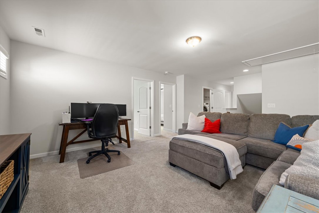 216 Carvel Trail Seneca, SC 29678 - Photo 23 of 48 This versatile living space offers comfortable carpeting and convenient recessed lighting.