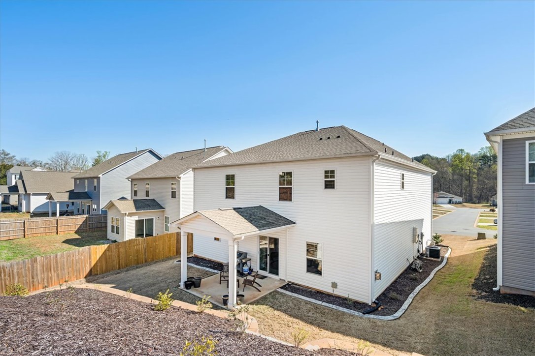 216 Carvel Trail Seneca, SC 29678 - Photo 48 of 48 This two-story residence features a charming covered patio overlooking a private backyard.