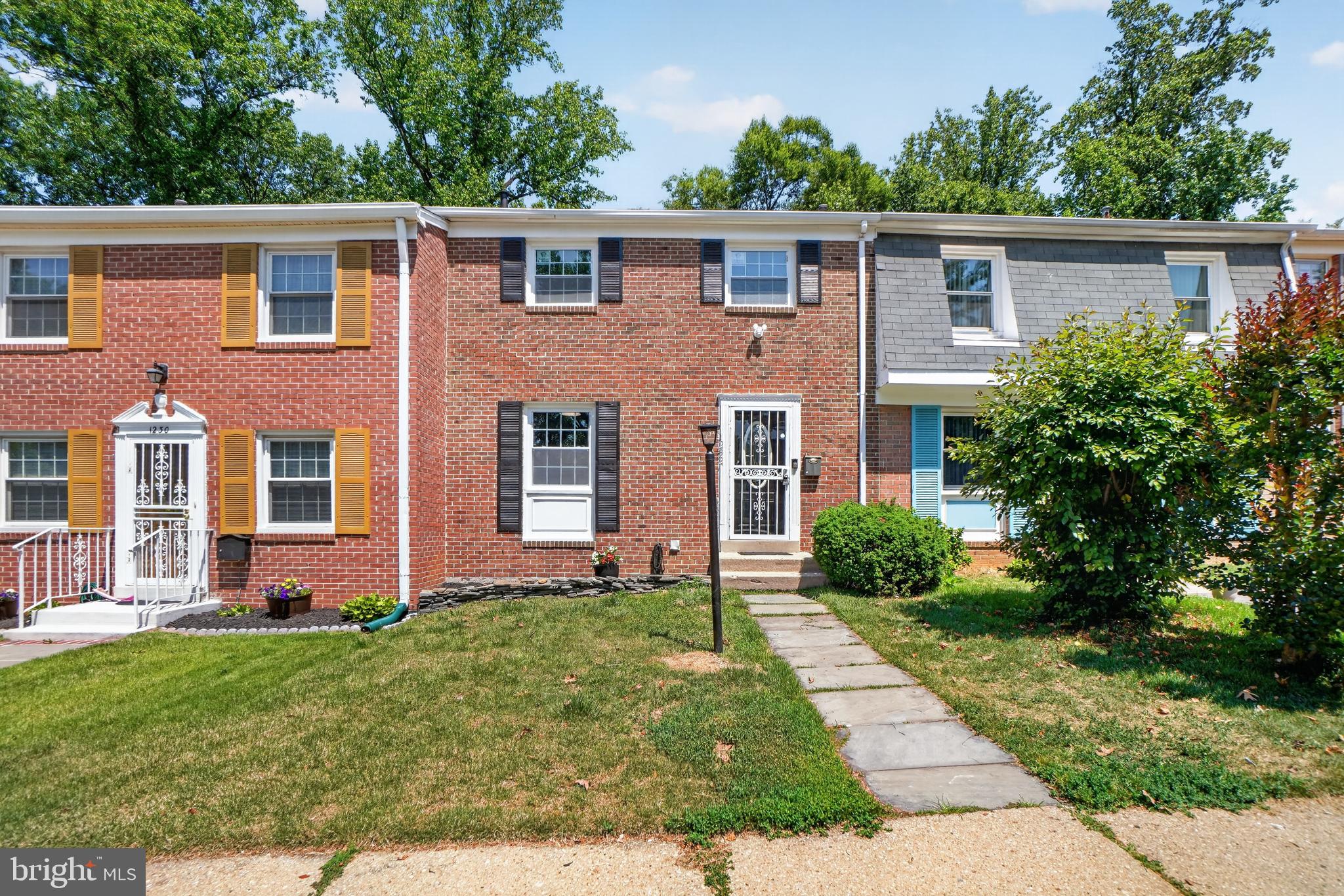 1232 Palmer Road, Unit 111 Fort Washington, MD 20744 - Photo 2 of 45 front view of a house with a yard
