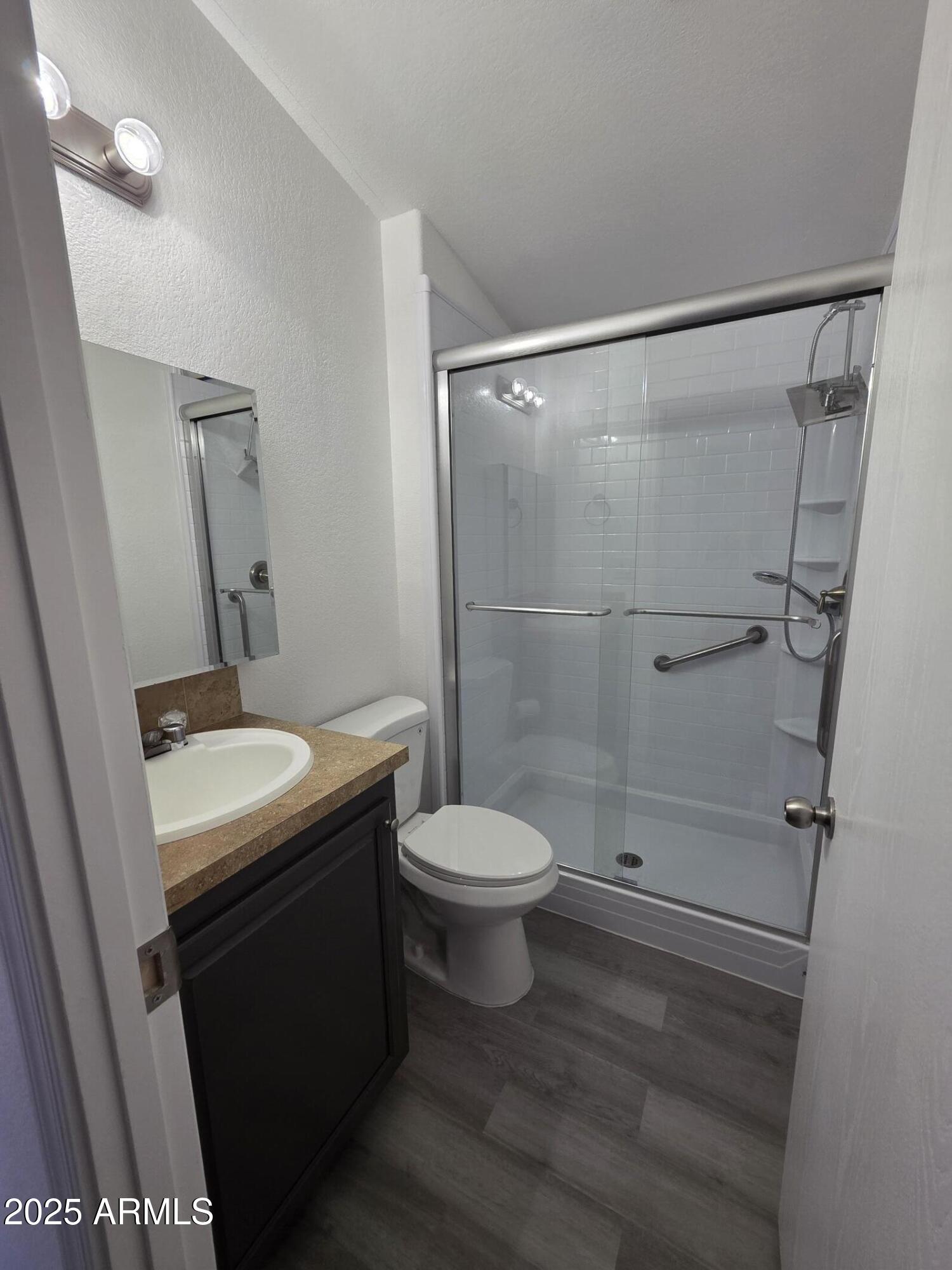 7807 East Main Street, Unit C6 Mesa, AZ 85207 - Photo 11 of 32 a bathroom with a sink a toilet and shower