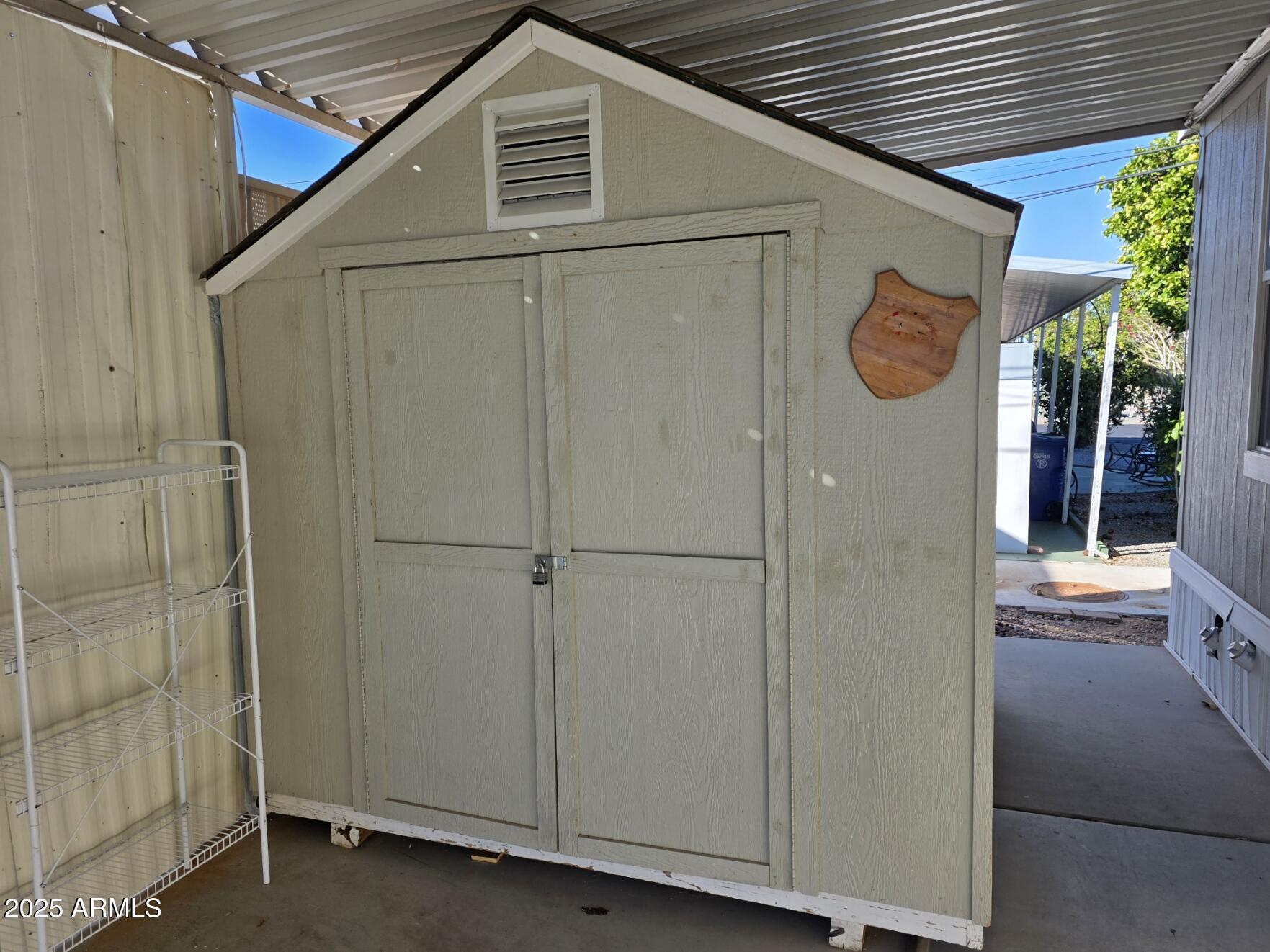 7807 East Main Street, Unit C6 Mesa, AZ 85207 - Photo 21 of 32 a view of a house with a wooden fence