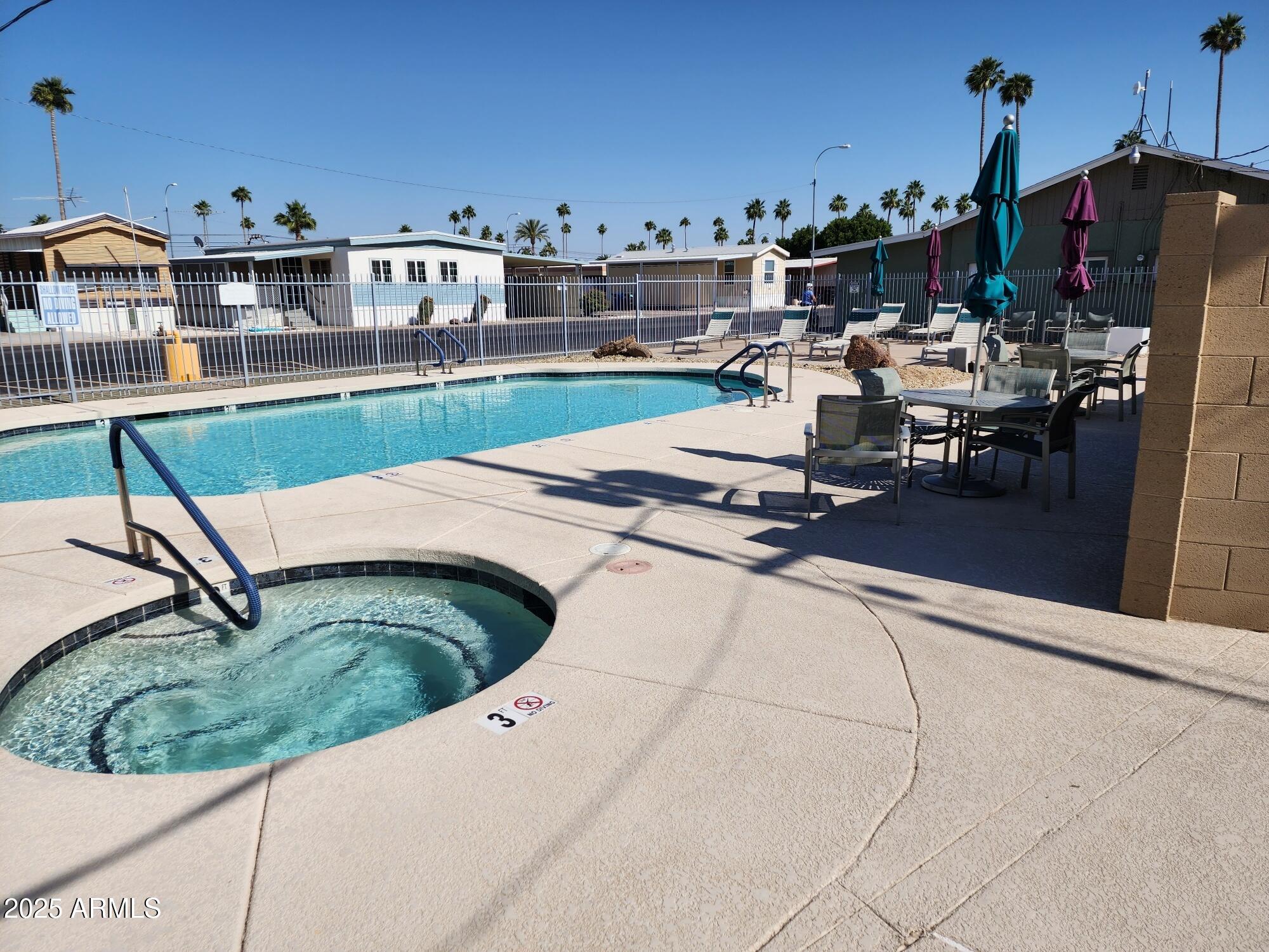 7807 East Main Street, Unit C6 Mesa, AZ 85207 - Photo 26 of 32 a view of a terrace with chairs