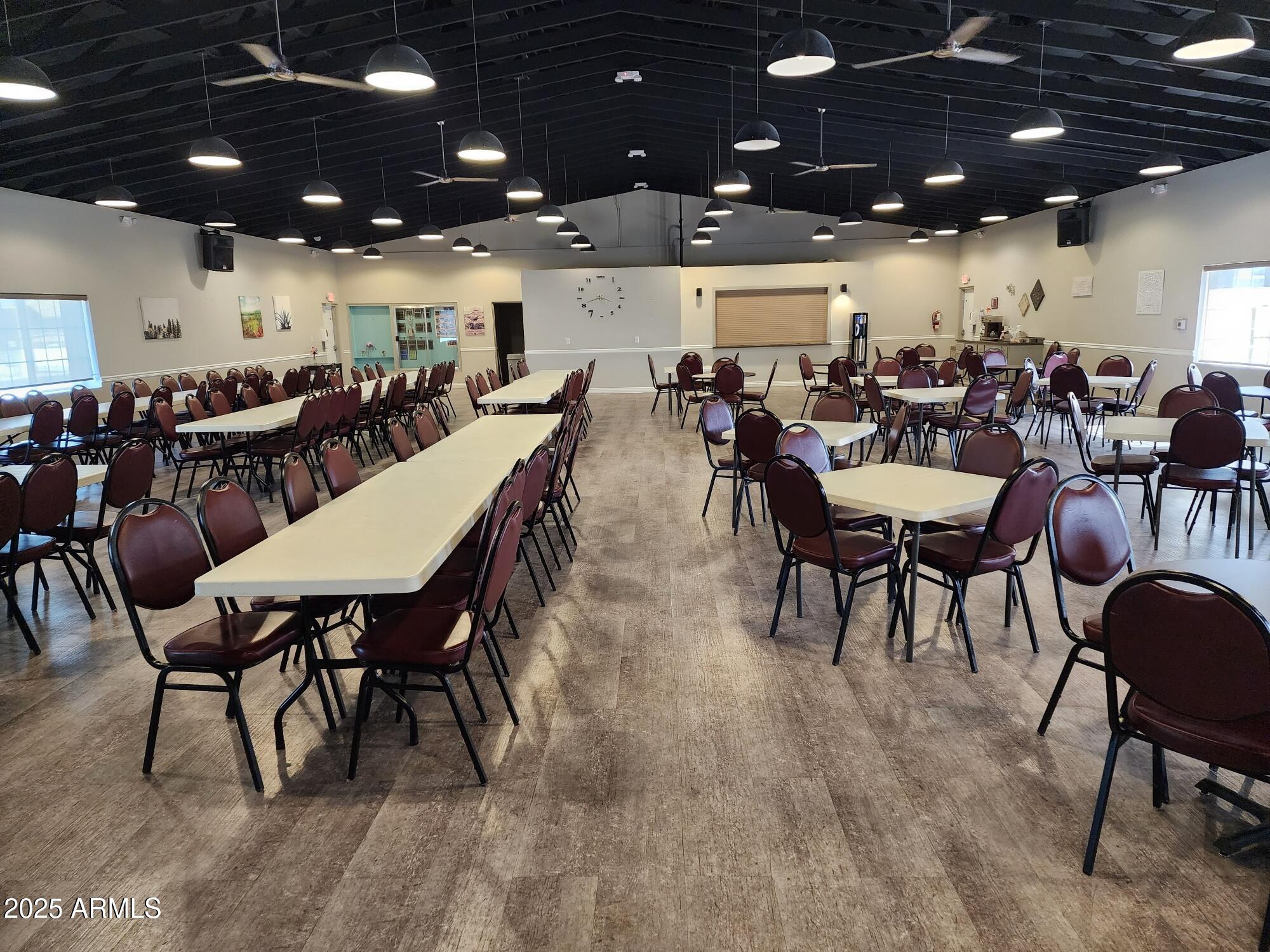 7807 East Main Street, Unit C6 Mesa, AZ 85207 - Photo 27 of 32 a outdoor dining space with lots of furniture and a projector