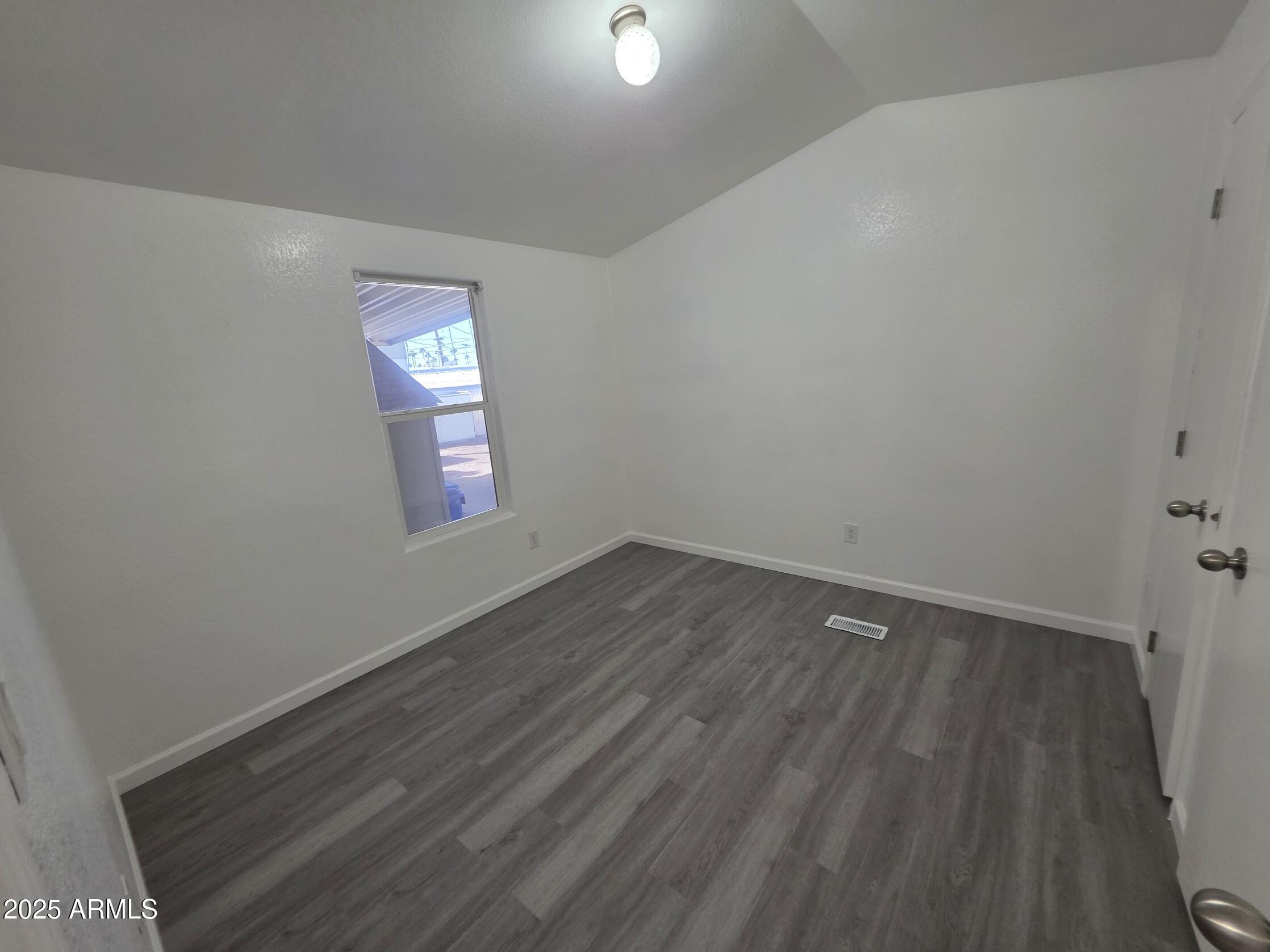 7807 East Main Street, Unit C6 Mesa, AZ 85207 - Photo 9 of 32 a view of an empty room and window