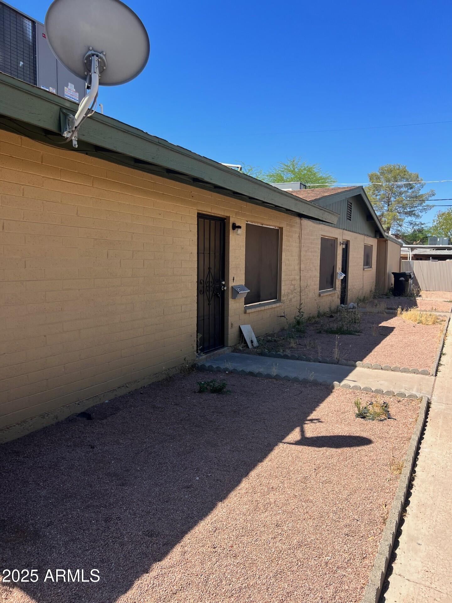 a view of a backyard with a patio