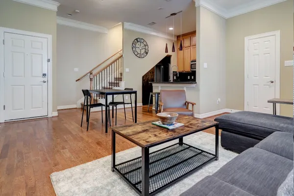 a living room with furniture and a table