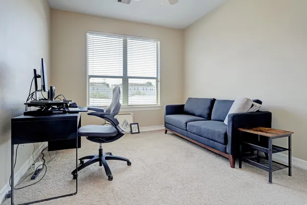 a living room with furniture and a window