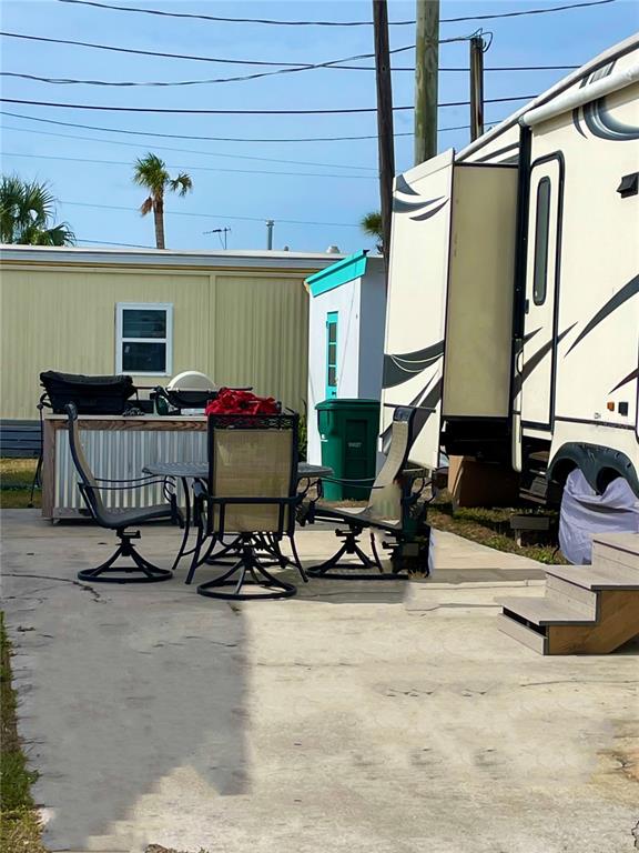 73 Main Street Palmetto, FL 34221 - Photo 3 of 18 a view of house with outdoor seating space