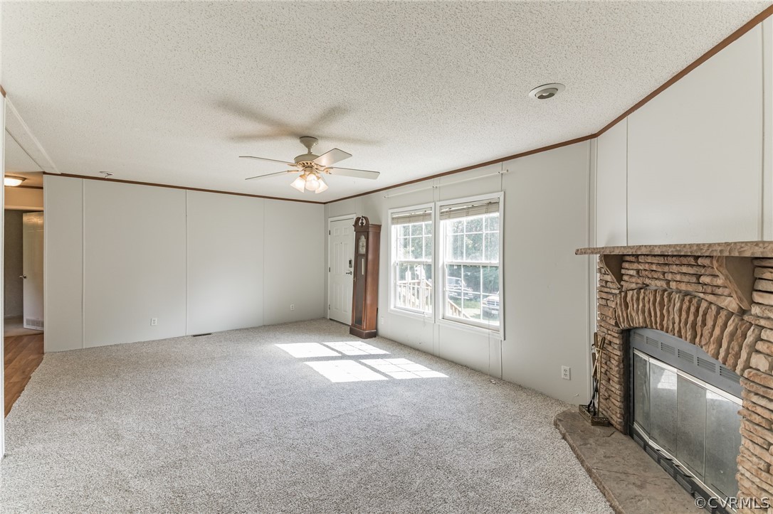 11535 Belfonte Road Bumpass, VA 23024 - Photo 4 of 24 Gas fireplace and ceiling fan